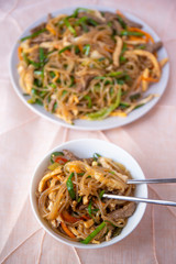 Stir fried Korean glass noodle with soy sauce called Japchae