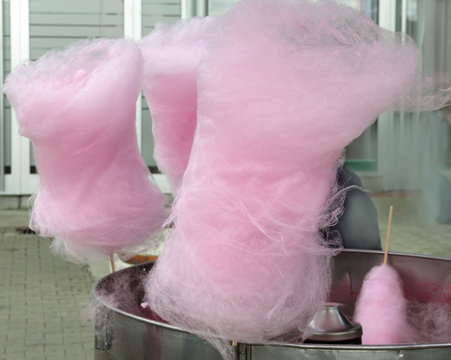 Pink cotton candies on the cotton condy machine.