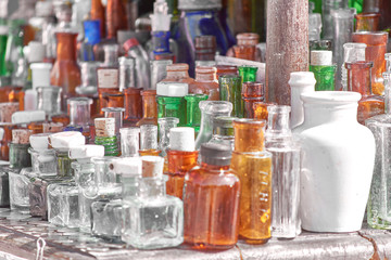Collection of glass multi-colored vintage perfume bottles.