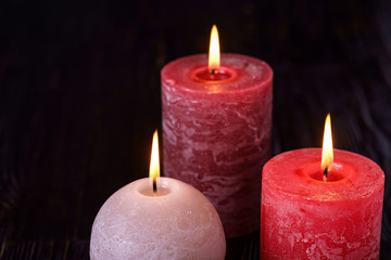 Three wax flame candlelight in dark romantic light, love dating, Valentine's day, selective focus
