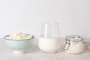 cottage cheese, milk and yogurt on a white background