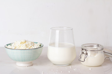 cottage cheese, milk and yogurt on a white background