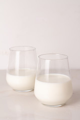 glass of milk on wooden table