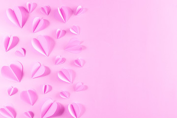 Pink hearts on pastel pink paper background. Background for Valentines day Mother's day, Women's day.