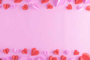 Backgrounds for Valentines day with pink and red hearts on pastel pink paper background. Banner, website, postcard, background.