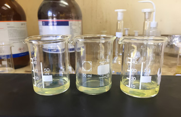 laboratory flask with yellow liquid