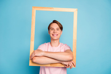 Portrait of content guy hold wooden brick frame make picture of himself wear good looking outfit isolated over blue color background