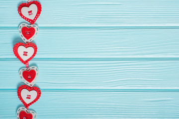 Valentines day red hearts on a blue wooden background