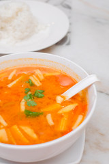 Photo of Seafood Tomyam soup in the white bowl - Thai food