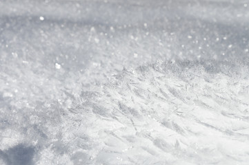 Snow background with detailed snowflakes. A macro photo of real snow crystals: large stellar...