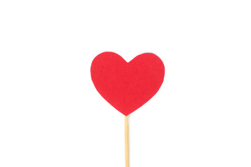 Оne red felt heart on a stick on a white isolated background. Stock photo for the day of St. Valentine with empty space for your text. For web, print, postcards and wallpaper.