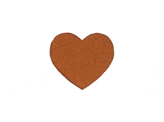Оne felt brown heart on a white isolated background. Stock photo for the day of St. Valentine with empty space for your text. For web, print, postcards and wallpaper.