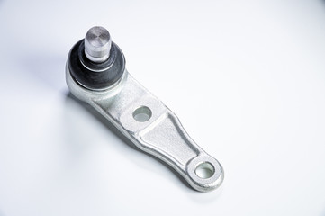 New spare parts spherical ball joints of a suspension bracket of a car on a gray background