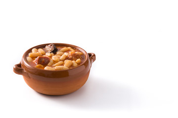 Typical Spanish fabada asturiana isolated on white background.Copy space