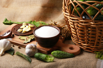 The process of preparing pickled cucumbers in the form of a still life with the main ingredients