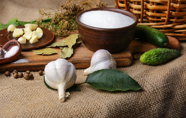 The process of preparing pickled cucumbers in the form of a still life with the main ingredients