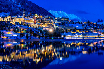 View of St. Moritz in Switzerland at night in winter - obrazy, fototapety, plakaty
