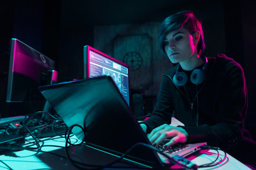 Wanted hackers coding virus ransomware using laptops and computers in the basement. Cyber attack,...