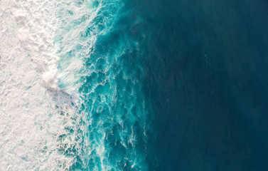 Aerial view to waves in ocean Splashing Waves. - obrazy, fototapety, plakaty