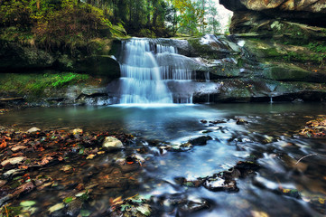 autumn waterfall. picturesque waterfall in the Carpathian mountains