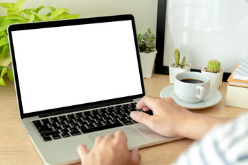 mockup image blank screen computer with white background for advertising text,hand woman using laptop contact business search information on desk at coffee shop.marketing and creative design