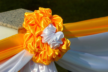 Decorative flower made of yellow and white ribbons, traditional colors of Thailand