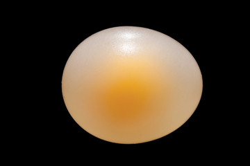 Bouncy egg made by submerging whole raw egg in vinegar for a week.