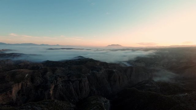 Aerial of epic cinematic sunset over valley