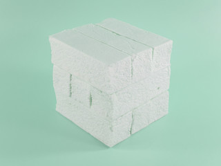 Sweet green marshmallow with mint flavor in the form of a geometric shape