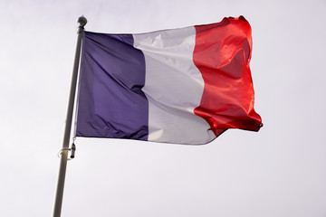 Flag of France waving over sky blue white red color