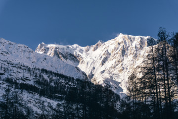 The Monte Rosa, one of the most beautiful peaks in the Italian Alps, during a sunny winter day, near the town of Macugnaga, Italy- December 2019.