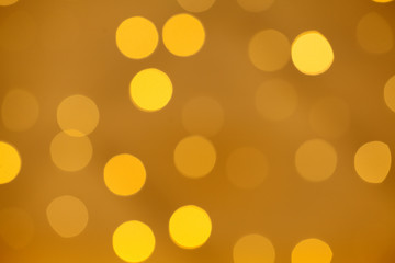 Gold bokeh light abstract background, defocused glitter decorations