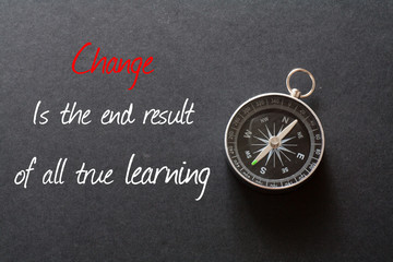 Inspirational quote : Change is the end result of all true learning ,on black background with compass