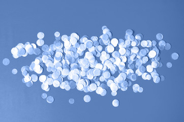 Beautiful background with round confetti in classic blue.