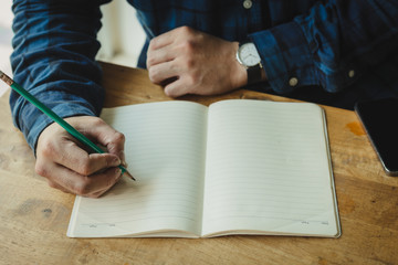 high school,university student study.hands holding pencil writing paper answer sheet.sitting lecture chair taking final exam attending in examination classroom.concept scholarship for education abroad