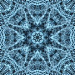 blue yarn for knitting and crochet seen through kaleidoscope lens with heart shapes