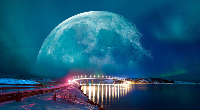 Sommaroy Bridge is a cantilever bridge connecting the islands of Kvaloya and Sommaroy with Aurora Borealis with full moon - Hillesoy Tromso Norway "Elements of this image furnished by NASA"