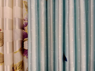 the background of the textile pattern of blue and brown curtains for sale in  the local store of Thailand
