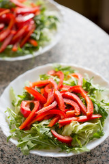 Rocket leaves, lettuce with red pepper sliced
