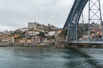 Dom Luis I Bridge above the Douro River in Porto, Portugal. Eiffel’s style of iron construction...