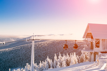 Funicular in the snowy mountains. Gondola. Holidays in the mountains. Snow-covered Christmas trees. Sports recreation