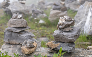 Fototapeta na wymiar Two piles of rocks on a mountain side