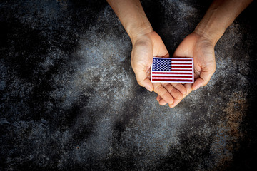 American flag in him hand. - Love, care, protect and safe concept.