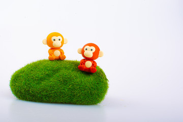 Monkey rubber toys, cute animal shaped rubber doll isolated in white background