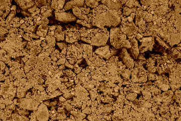 Stones filled with brown concrete, texture close-up