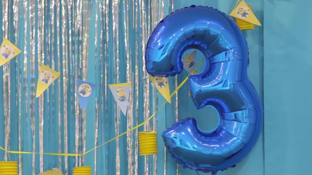 3 years birthday balloon on children minions style happy birthday party yellow blue colors design decorations background