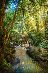 A young tourist enjoying the river of the Cerro Azul Meambar National Park (Panacam) in Yojoa. Honduras
