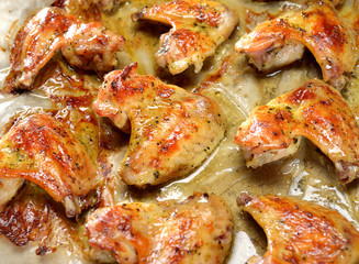 grilled chicken wings on a baking sheet