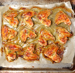 grilled chicken wings on a baking sheet