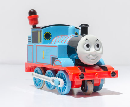 londonm england, 05/05/2019 A plastic thomas the tank engine train toy isolated on a white studio background. Children plastic toys made in china. steam and coal engine trains.